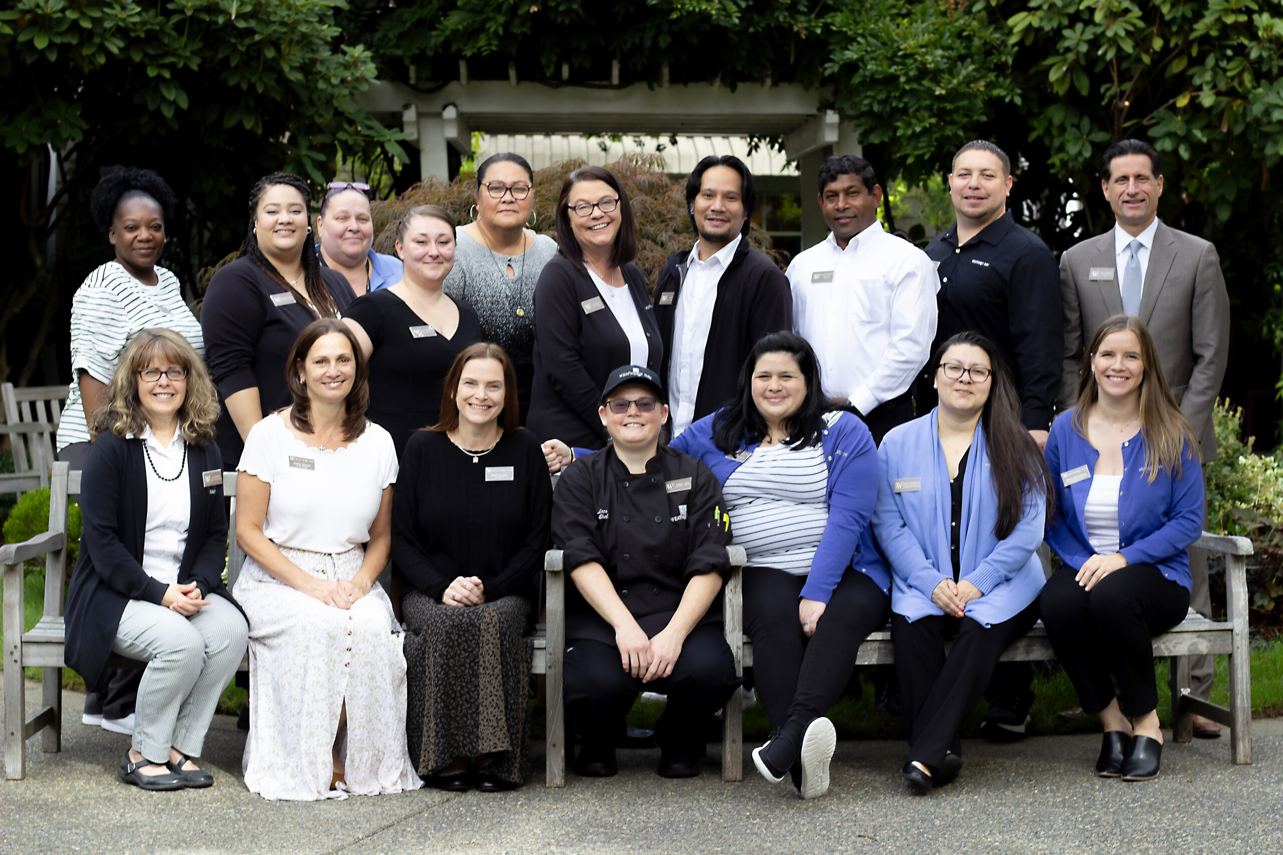 Group of Weatherly Inn staff members smiling at the camera.